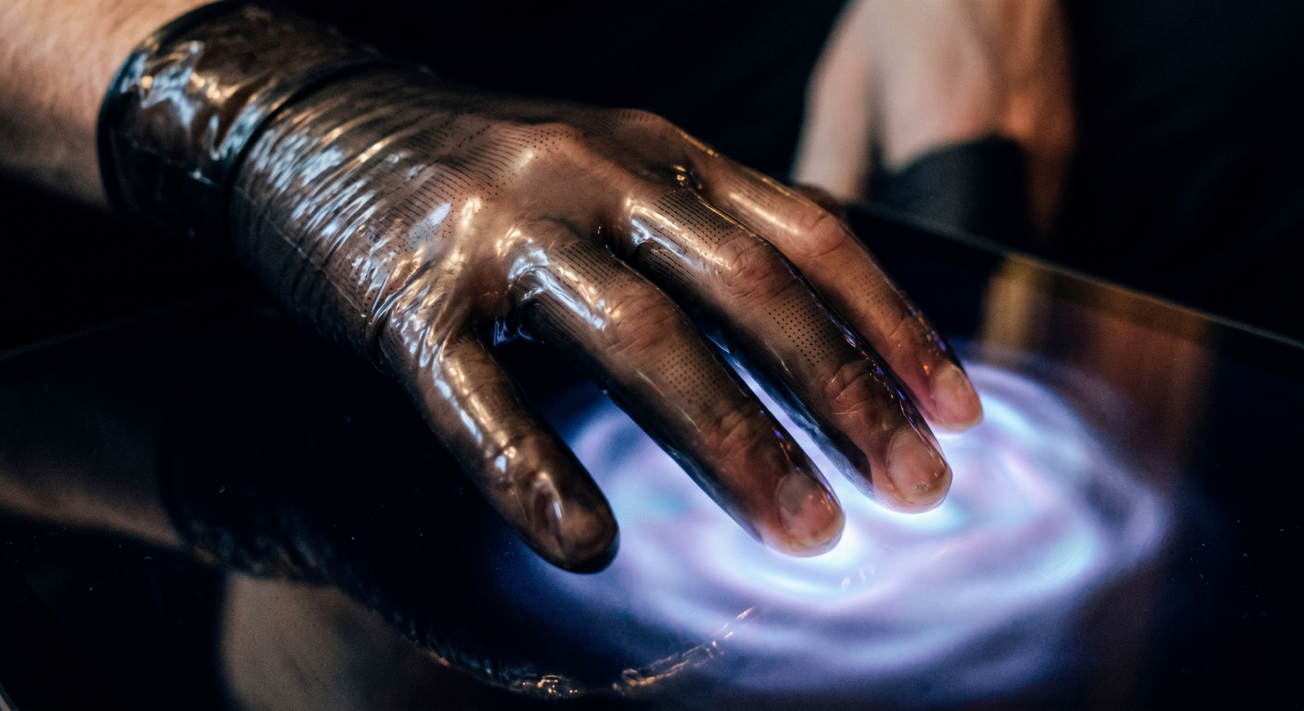 close-up-iphone-photo-of-haptic-glove-touching-light-interface